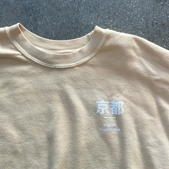 Urban Outfitters cropped graphic sweatshirt. Pale yellow. Kyoto Champions - Picture 2 of 3